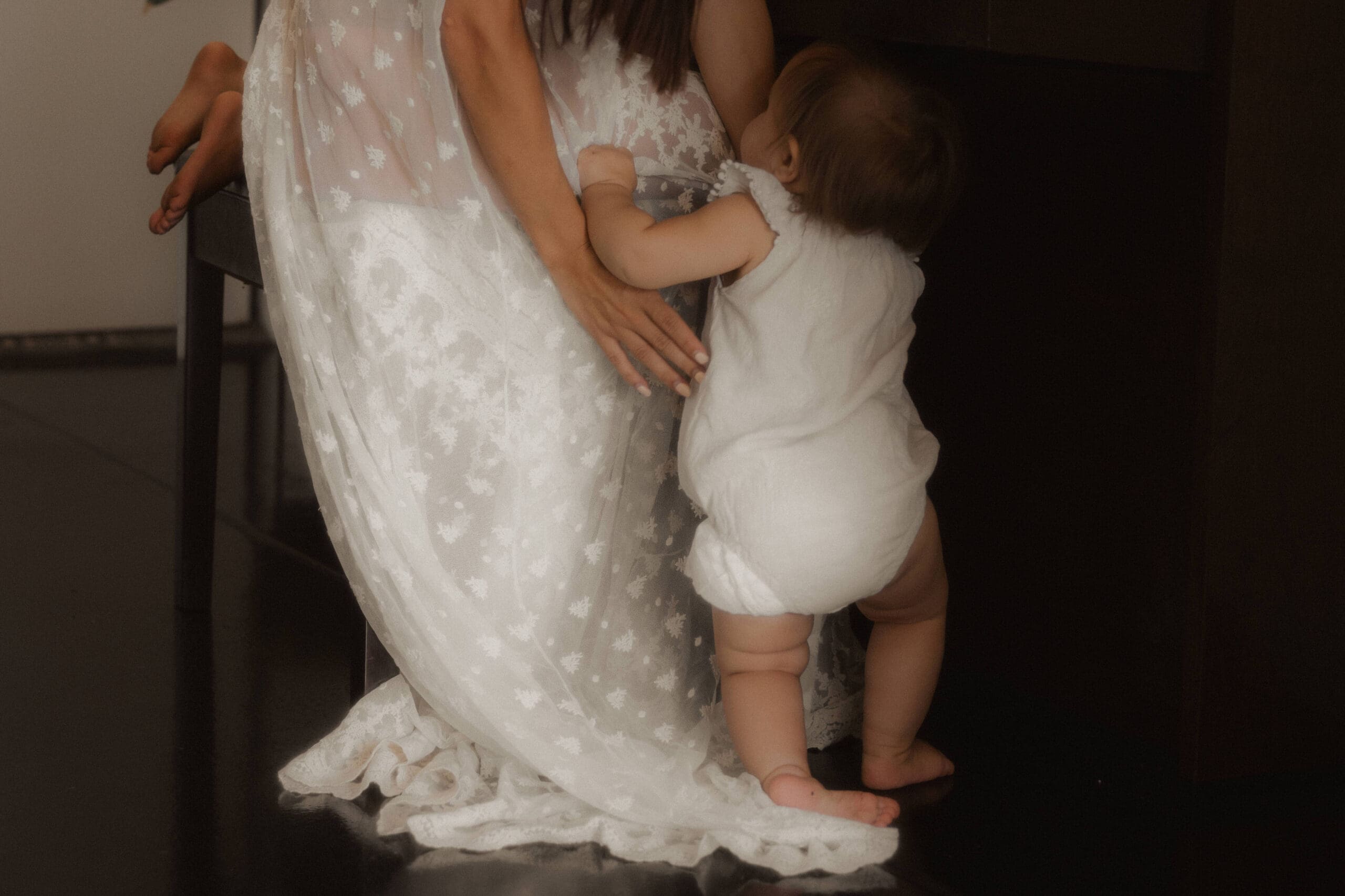 mother picking up child tenderly