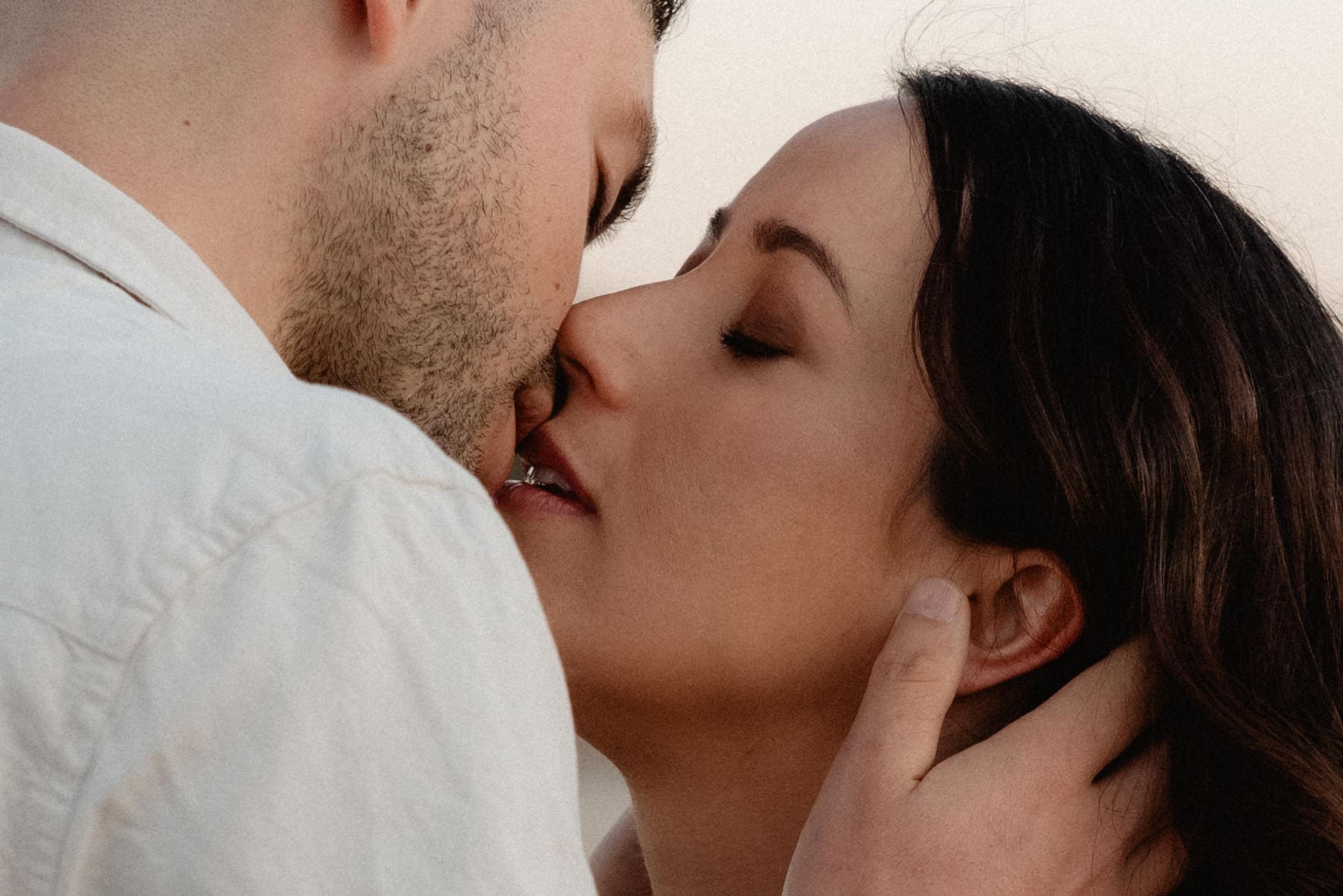 Intimate moment between soon to be parents at maternity workshop